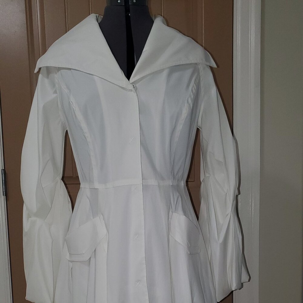 Samuel Dong white lined coat with a snap closer